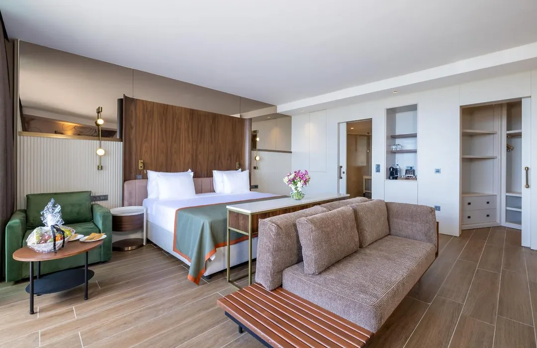 Nirvana Cosmopolitan Hotel Antalya Room photo This is a photograph of a modern, well-appointed hotel room or suite.